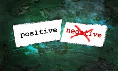 Positive And Negative Written On Piece Of Paper